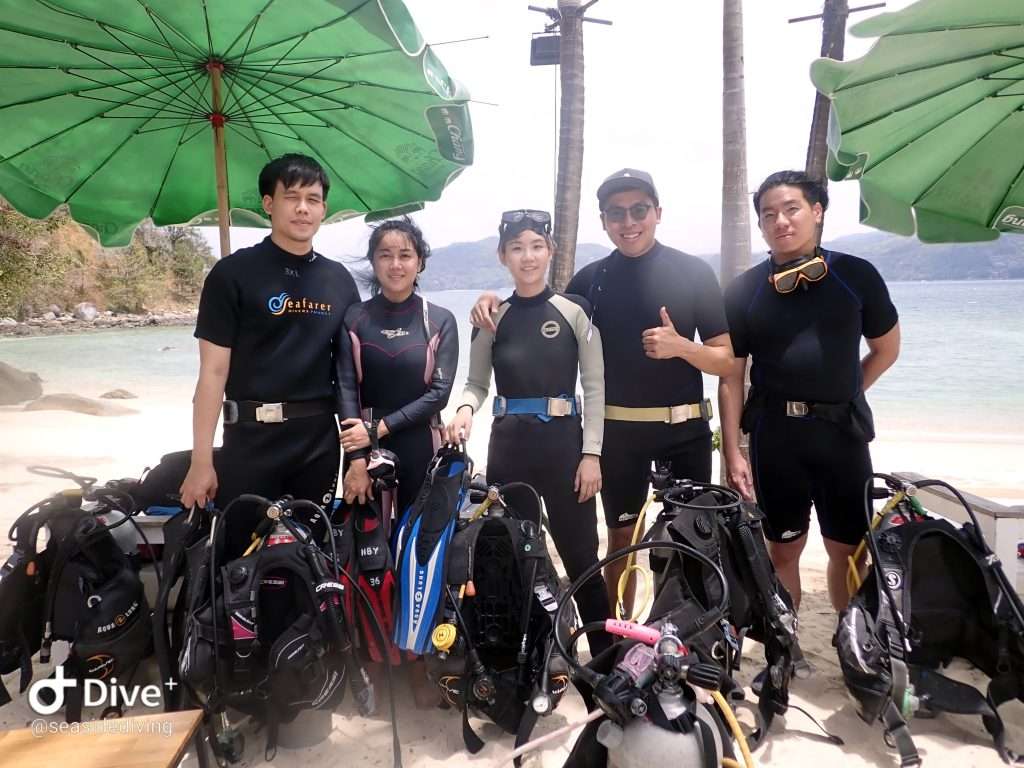 Divers assembling equipment before dive